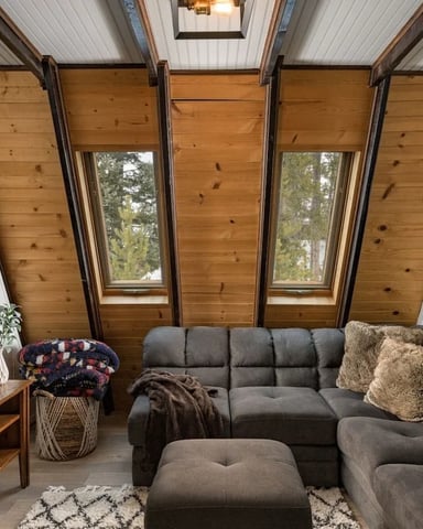 Mountain house at the base of a rocky cliff